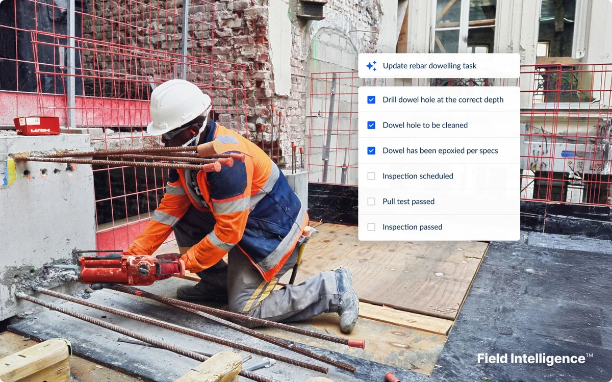 Construction worker installing rebar with Fieldwire Field Intelligence task checklist overlay showing 'Update rebar dowelling task' with steps for drill dowel hole, dowel hole cleaned, dowel epoxied, inspection scheduled, pull test passed